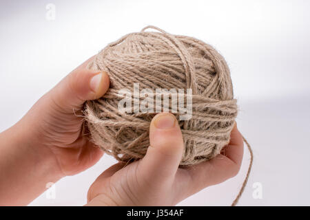 Spools of thread in hand isolated on a white background Stock Photo