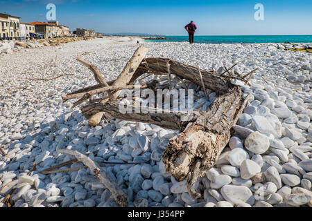 MARINA DI PISA, ITALY - Avril 24, 2017: View of the sea and the beach of white pebbles in Marina di Pisa Tuscany Stock Photo