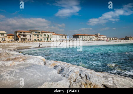 MARINA DI PISA, ITALY - Avril 24, 2017: View of the sea and the beach of white pebbles in Marina di Pisa Tuscany Stock Photo