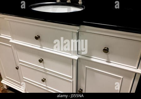 Bathroom granite or marble counter tops and backsplash with sinks and faucets Stock Photo