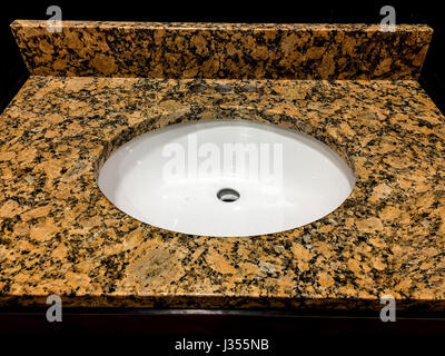 Bathroom granite or marble counter tops and backsplash with sinks and faucets Stock Photo