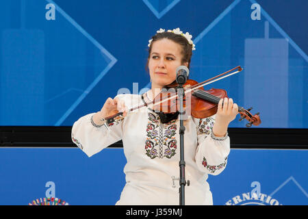 Woman playing a violin on stage - USA Stock Photo
