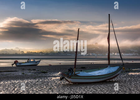Instow, North Devon, UK. 2nd May, 2017. UK Weather - Mist rolls across the North Devon village of Instow as the sun briefly breaks through the low cloud at dawn in early May. Credit: Terry Mathews/Alamy Live News