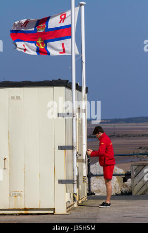 Crosby, Merseyside, UK. 3rd May, 2017. UK Weather. Bright, sunny day at the coast for people on the coastal promenade with the artwork of Antony Gormley's IronMen in the background facing the Irish Sea. Credit: MediaWorldImages/Alamy Live News Stock Photo