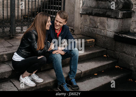 A student couple in love flirting outside school Stock Photo