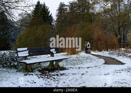 Elderly couple walking on path in late autumn,  Chiemgau Upper Bavaria Germany Europe Stock Photo
