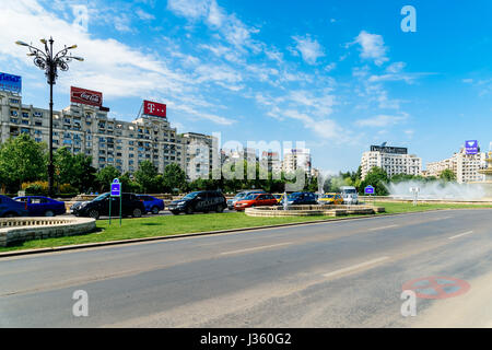 BUCHAREST, ROMANIA - MAY 19, 2015: Rush Hour Traffic In Union Square (Piata Unirii) one of the busiest and largest traffic intersections in downtown B Stock Photo