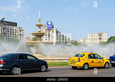 BUCHAREST, ROMANIA - MAY 19, 2015: Rush Hour Traffic In Union Square (Piata Unirii) one of the busiest and largest traffic intersections in downtown B Stock Photo