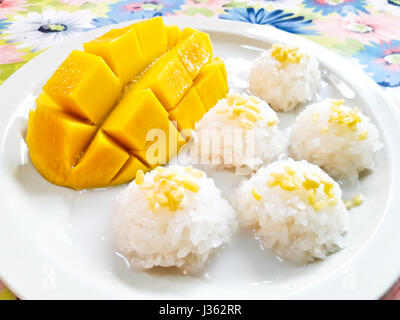 Thai style tropical dessert, sticky rice eat with mangoes Stock Photo