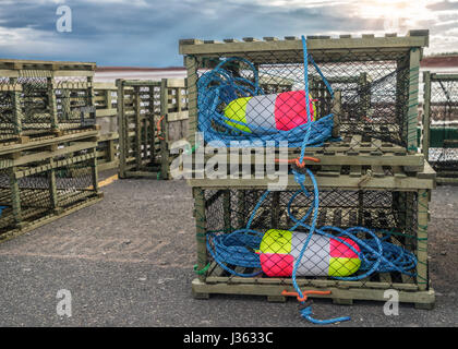 Lobster traps on a wharf along the shores of rural Prince Edward Island, Canada. Stock Photo