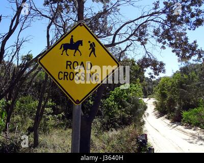 Warning sign advising road crossing Stock Photo