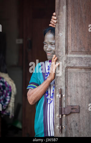 Chin region, Myanmar, November 11, 2014: daai tribe woman at her front door Stock Photo