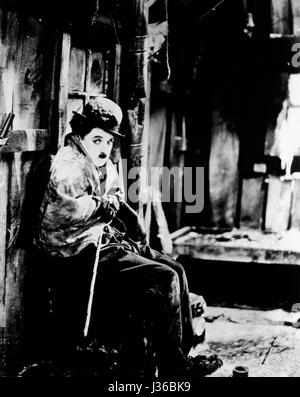 The Gold Rush   Year: 1925 USA  Director: Charles Chaplin  Charlie Chaplin.  It is forbidden to reproduce the photograph out of context of the promotion of the film. It must be credited to the Film Company and/or the photographer assigned by or authorized by/allowed on the set by the Film Company. Restricted to Editorial Use. Photo12 does not grant publicity rights of the persons represented. Stock Photo