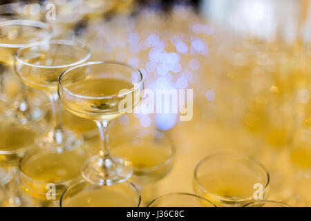 Champagne glasses pyramid on restaurant table Stock Photo