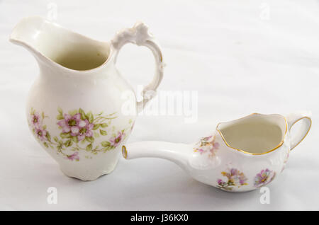 Hand painted antique poecelain creamer and pitcher Stock Photo
