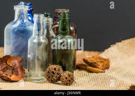 Vintage bottles in rustic setting Stock Photo