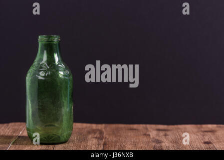 Vintage bottles in rustic setting Stock Photo