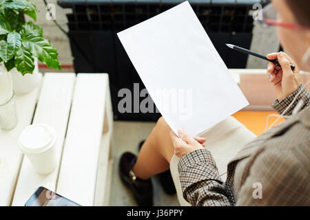 Female Hands with Blank Paper Sheet Stock Photo