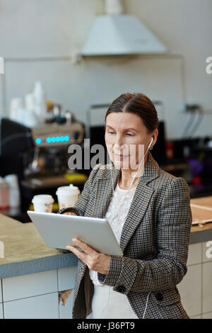 Senior Woman Using Digital Tablet Stock Photo