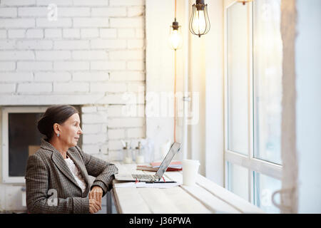 Preparing Business Presentation in Cyber Cafe Stock Photo