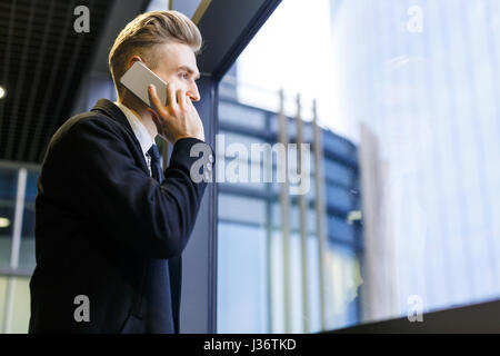 Businessman Talking to Friend on Smartphone Stock Photo