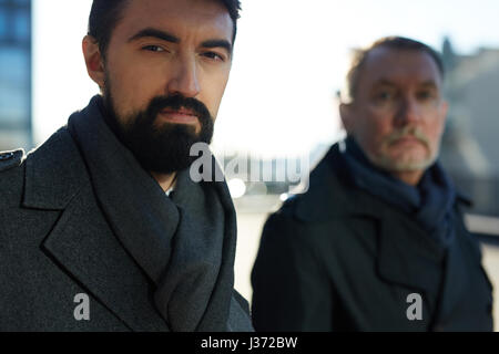 Two Serious Businessmen Outdoors Stock Photo