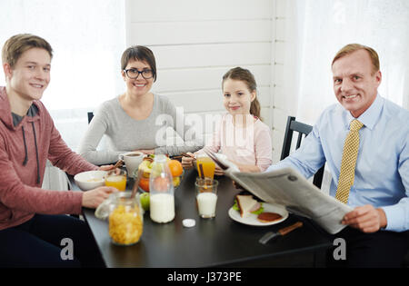 Family Portrait in Cozy Kitchen Stock Photo