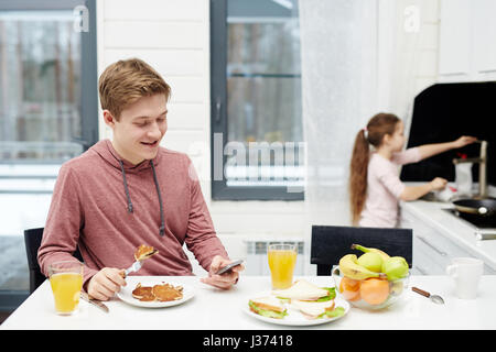 Smartphone Addiction of Teenage Boy Stock Photo