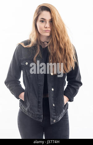 A pretty 15 year old girl in the studio against a white backdrop in the Uk Stock Photo