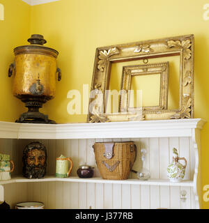 Assorted collection of antiques on shelf. Stock Photo