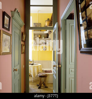 Pastel hallway leading to dining room. Stock Photo