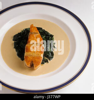 Dish with salmon and spinach. Stock Photo