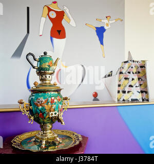 Tea pot beside painted wall. Stock Photo