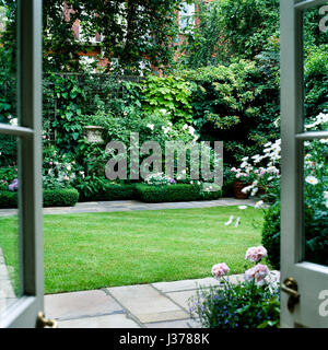 Back garden with pot plants. Stock Photo