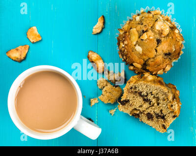 Banana and Chocolate Chip Muffins Agains a Blue Background Stock Photo