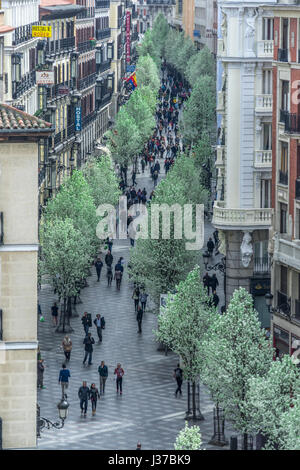 Madrid, Spain. March 21, 2017. People enjoying blooming cherry trees from Plaza de Isabel II along Arenal street (Calle del Arenal) to Puerta del Sol  Stock Photo