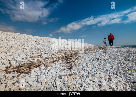 MARINA DI PISA, ITALY - Avril 24, 2017: View of the sea and the beach of white pebbles in Marina di Pisa Tuscany Stock Photo