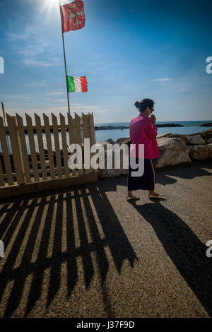 MARINA DI PISA, ITALY - Avril 24, 2017: Flag of Italy and the city of Pisa in Marina di Pisa, Tuscany Stock Photo