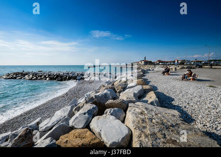 MARINA DI PISA, ITALY - Avril 24, 2017: View of the sea and the beach of white pebbles in Marina di Pisa Tuscany Stock Photo