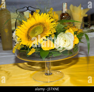 Mass decoration with flowers. A bouquet of yellow and white roses, sunflowers and wild plants Stock Photo