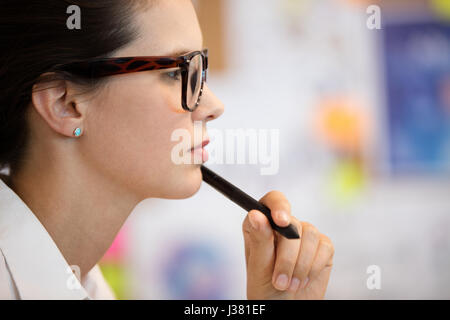Side view of concentrated businesswoman at office Stock Photo