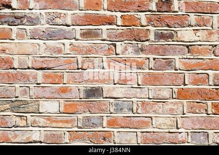 Lime mortar brick wall background showing repointing Stock Photo