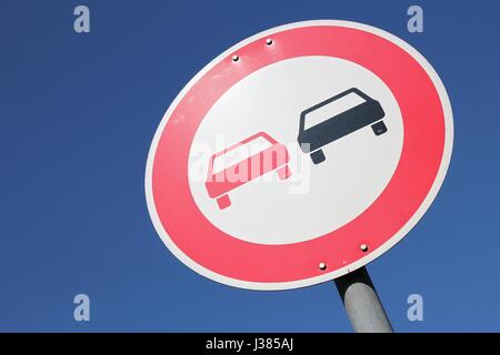 German road sign: no overtaking Stock Photo - Alamy