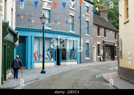 Traditional victorian town shops along a historic street in Blists Hill Museum, Ironbridge, Shropshire, UK Stock Photo