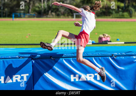 Primary school australian children participating in there primary school annual athletics events, here girl in the high jump,Sydney,Australia Stock Photo