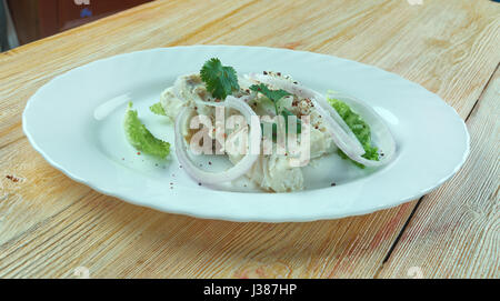 Sea bass ceviche on a White Plate. Stock Photo