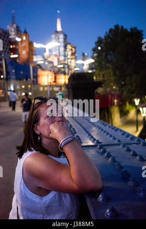 Female looking at the city skyline in Melbourne Australia