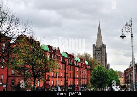 Minot's Tower of St. Patrick's Cathedral rises above Patrick Street in Dublin. The cathedral dates from 1254 to 1270. Dublin, Ireland. Stock Photo