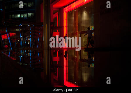 22.02.2017, Singapore, Republic of Singapore, Asia - Office workers are seen leaving an OCBC Bank building in Singapore's financial district. Stock Photo