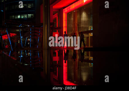 22.02.2017, Singapore, Republic of Singapore, Asia - Office workers are seen leaving an OCBC Bank building in Singapore's financial district. Stock Photo